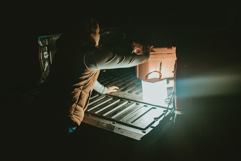 Woman taking out storage with use of LuminAID light