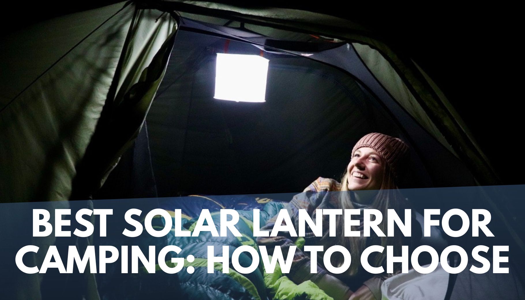 woman laying in camping tent with illuminated inflatable lantern above her