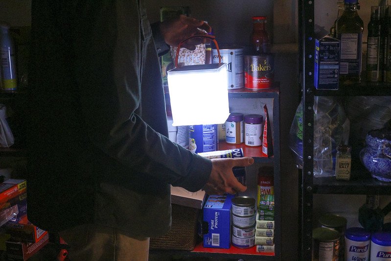 Person in their stockpile pantry. Source: LuminAID