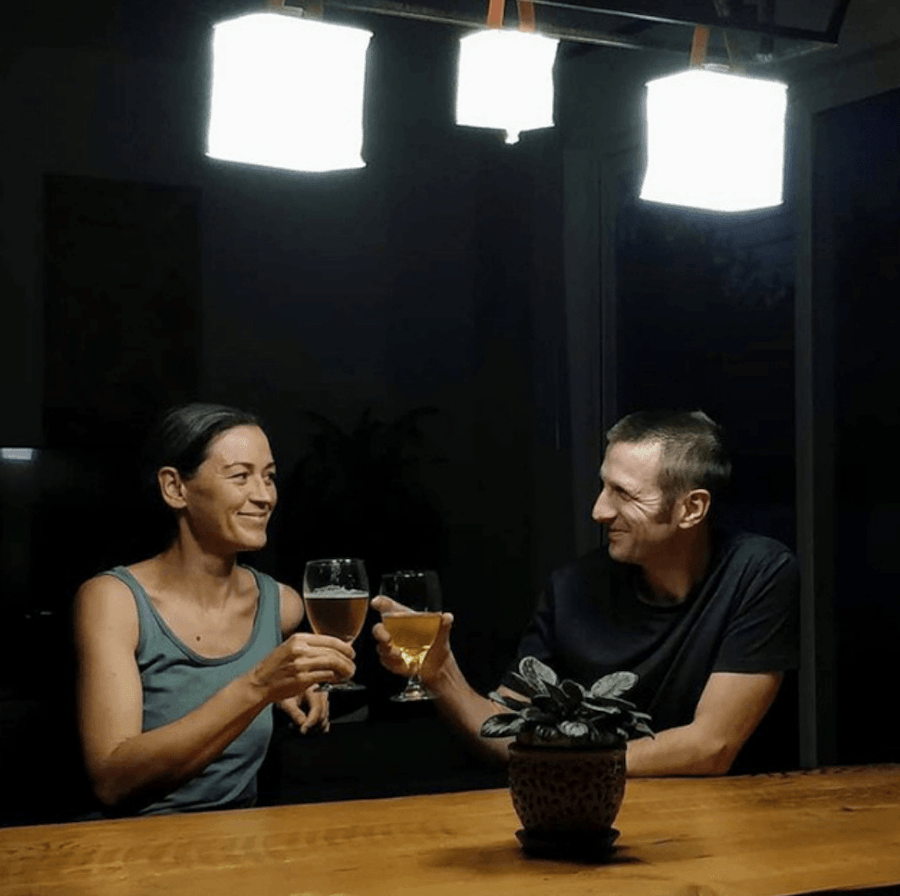 Man and woman drinking during a power outage