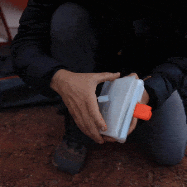 GIF showing a close-up of hands opening and closing the Titan Power Lantern