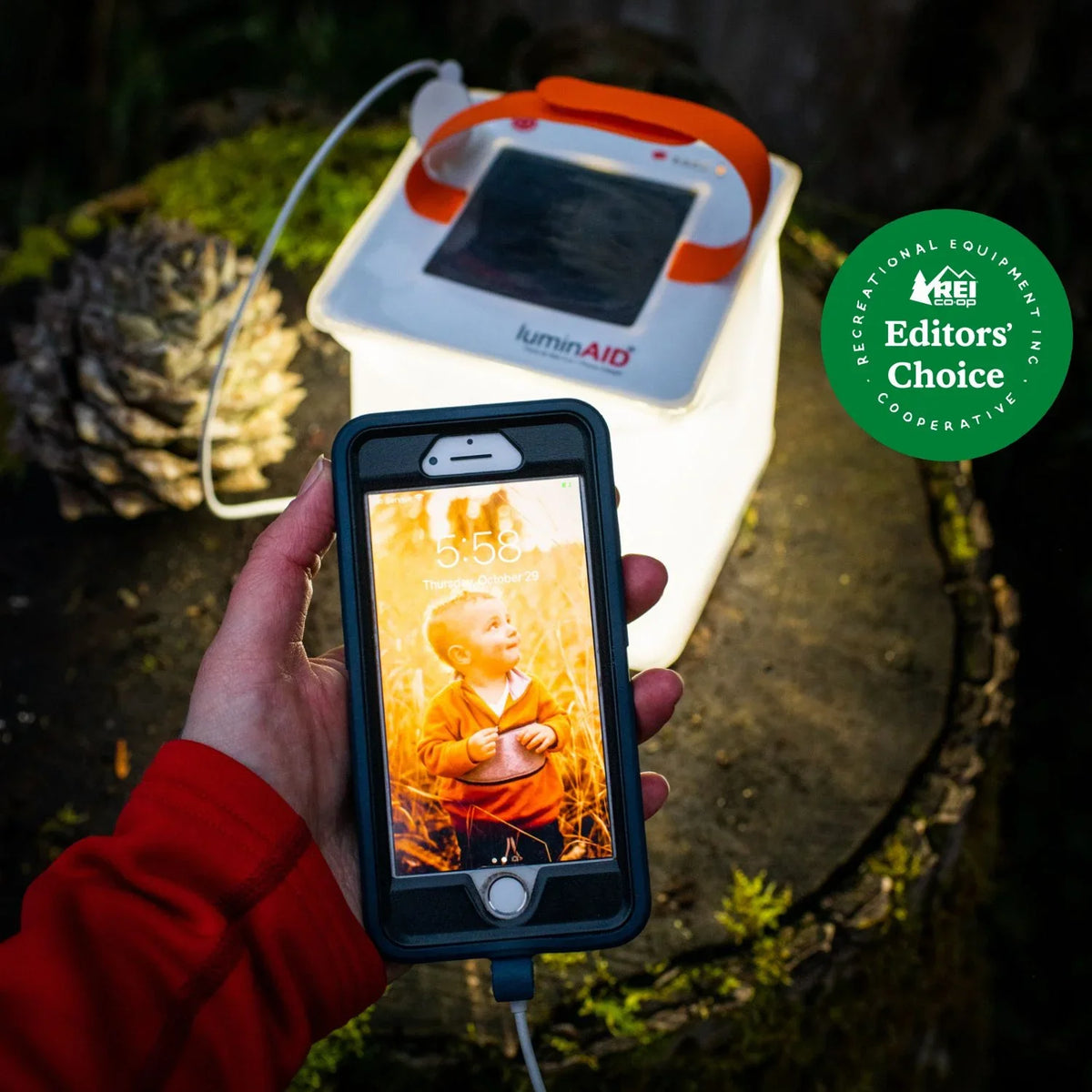 PackLite Max Charging a phone with green REI Editor's Choice Badge