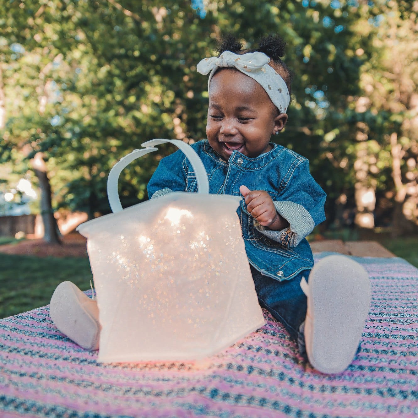 Child smiling at the firefly lantern.