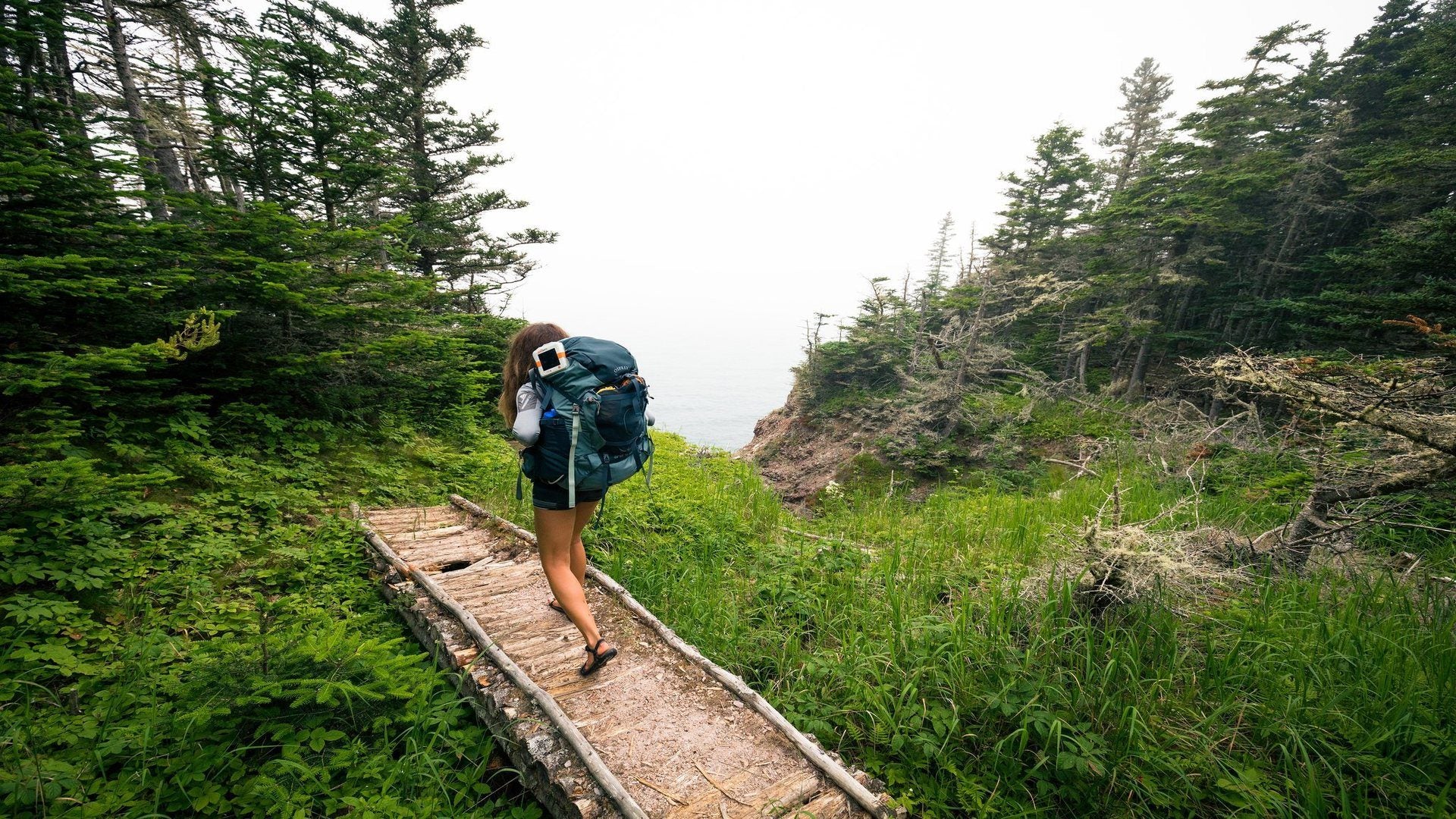 Woman backpacking in the beautiful outdoors. Source: Taylor Burk