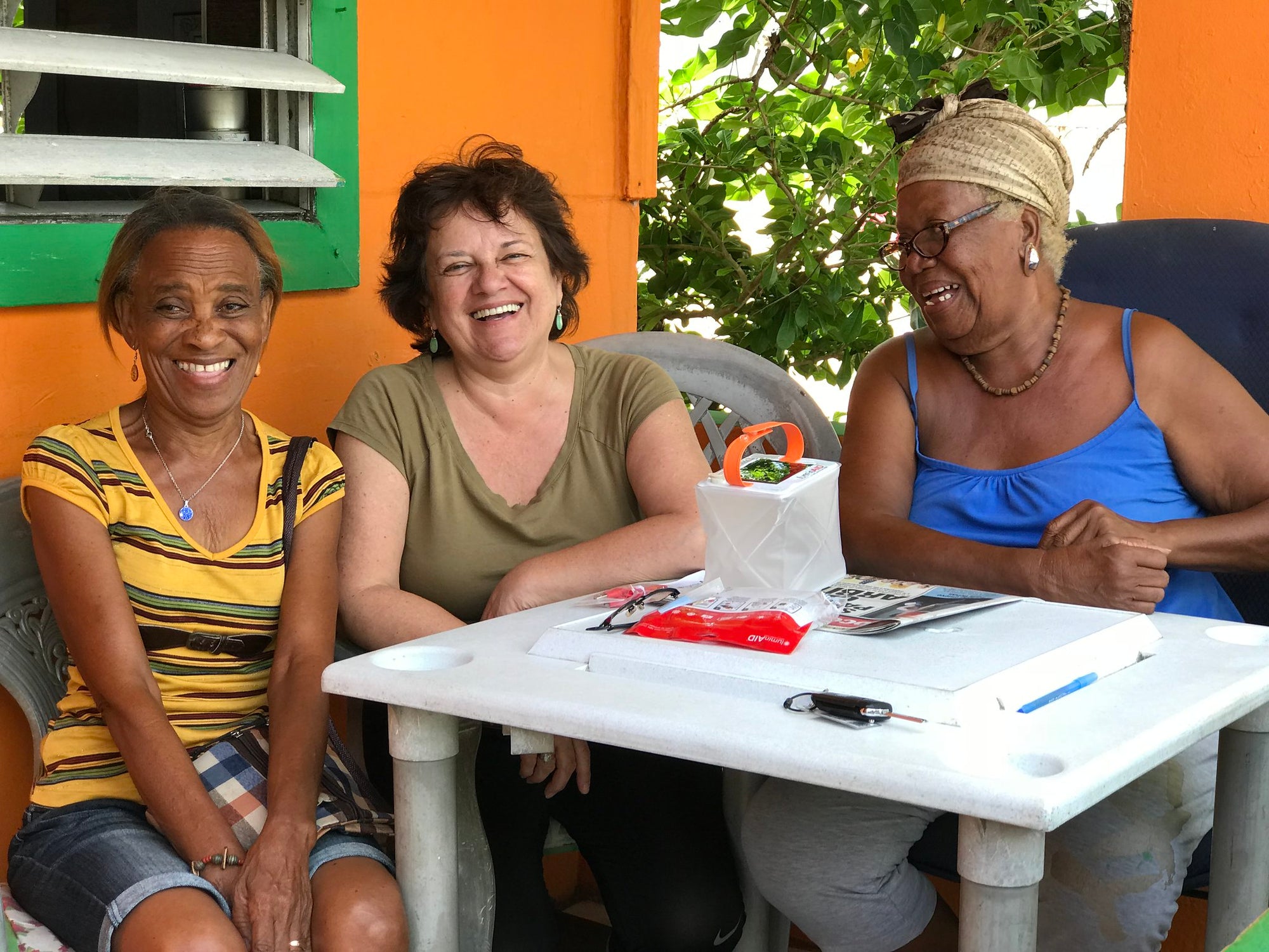 Three women smiling - photo courtesy of Perla De Leon, taken in Puerto Rico