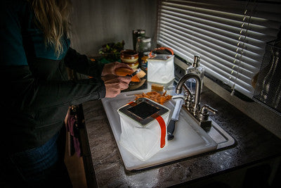 Person prepping food during a power outage. Source: Megan McKay