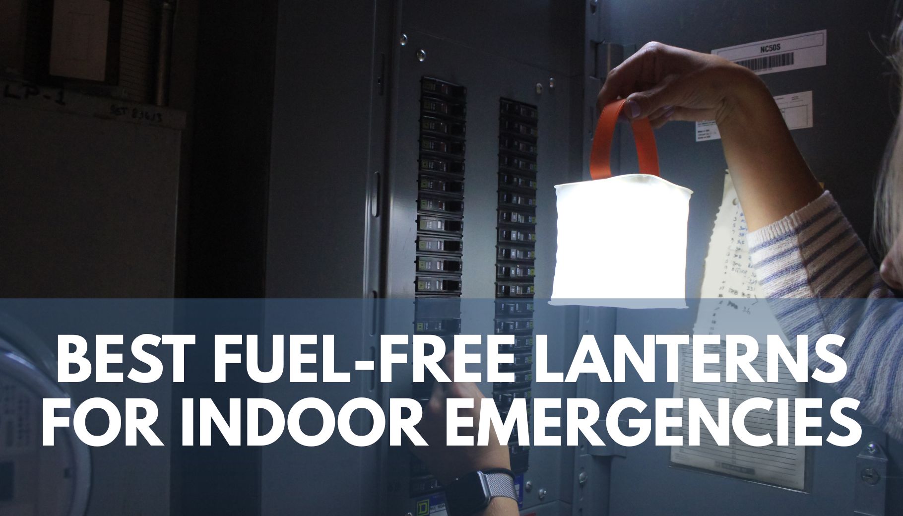 person holding an illuminated inflatable lantern in front of an open fuse box