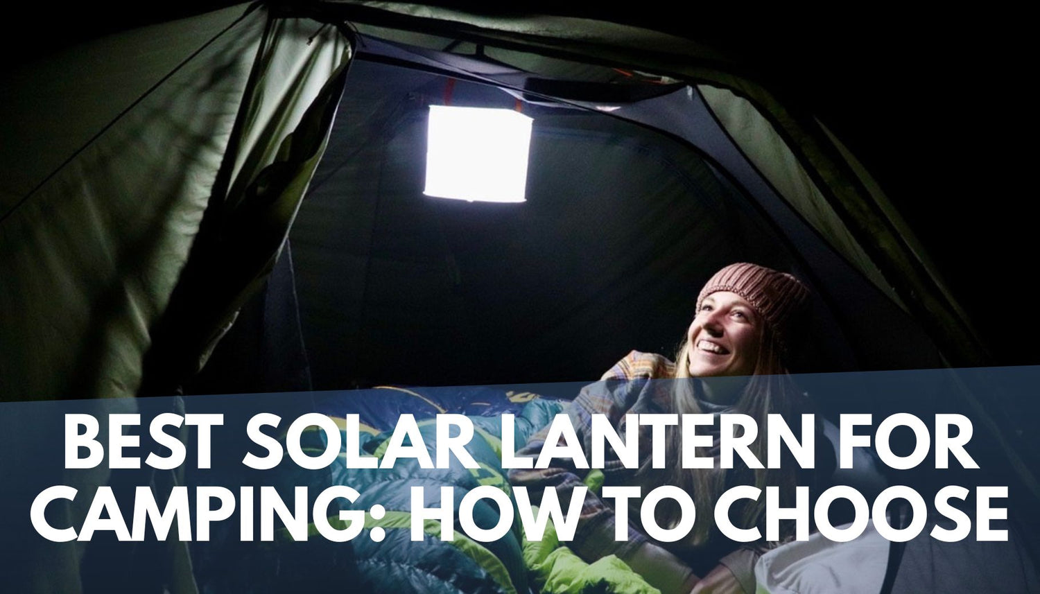 woman laying in camping tent with illuminated inflatable lantern above her