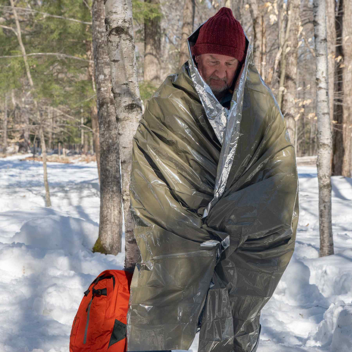 Man using the Heavy Duty Emergency Blanket