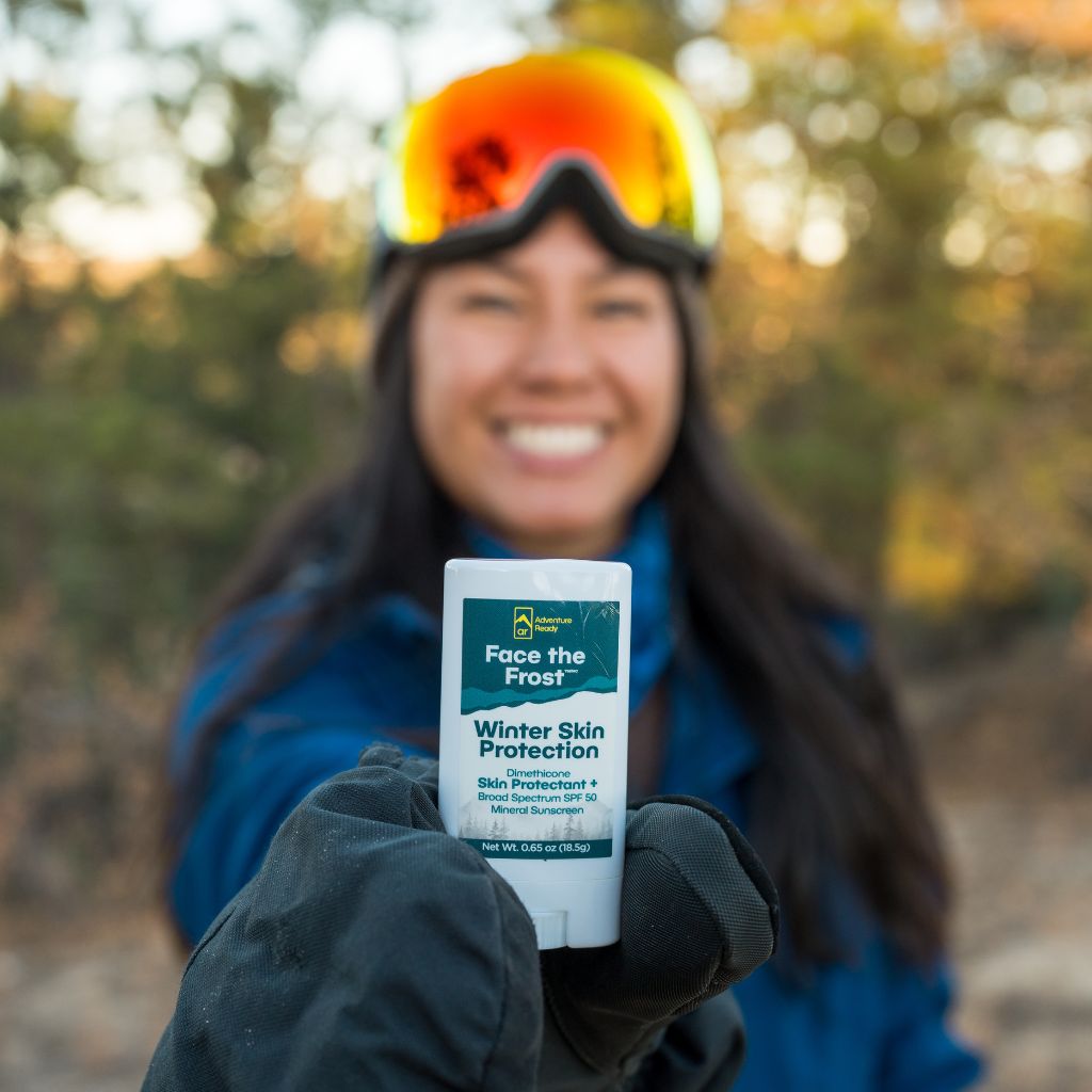 Skier holding Face the Frost