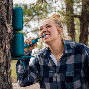 Woman brushing her teeth