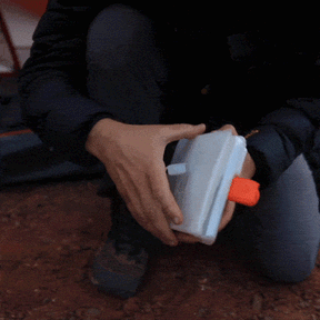 GIF showing a close-up of hands opening and closing the Titan Power Lantern