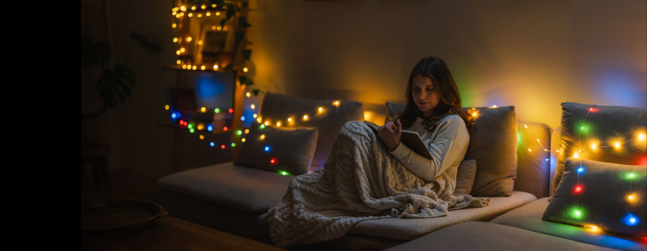 Woman reading with USB string lights