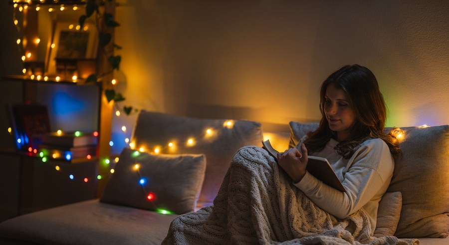 Woman reading with USB string lights