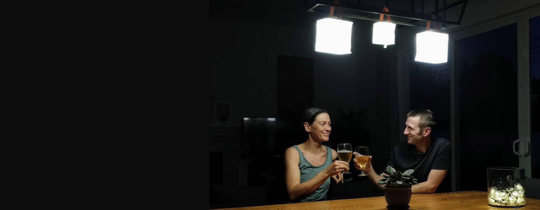 Man and woman drinking during a power outage