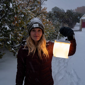 Firefly power lantern gives light in a snow storm.