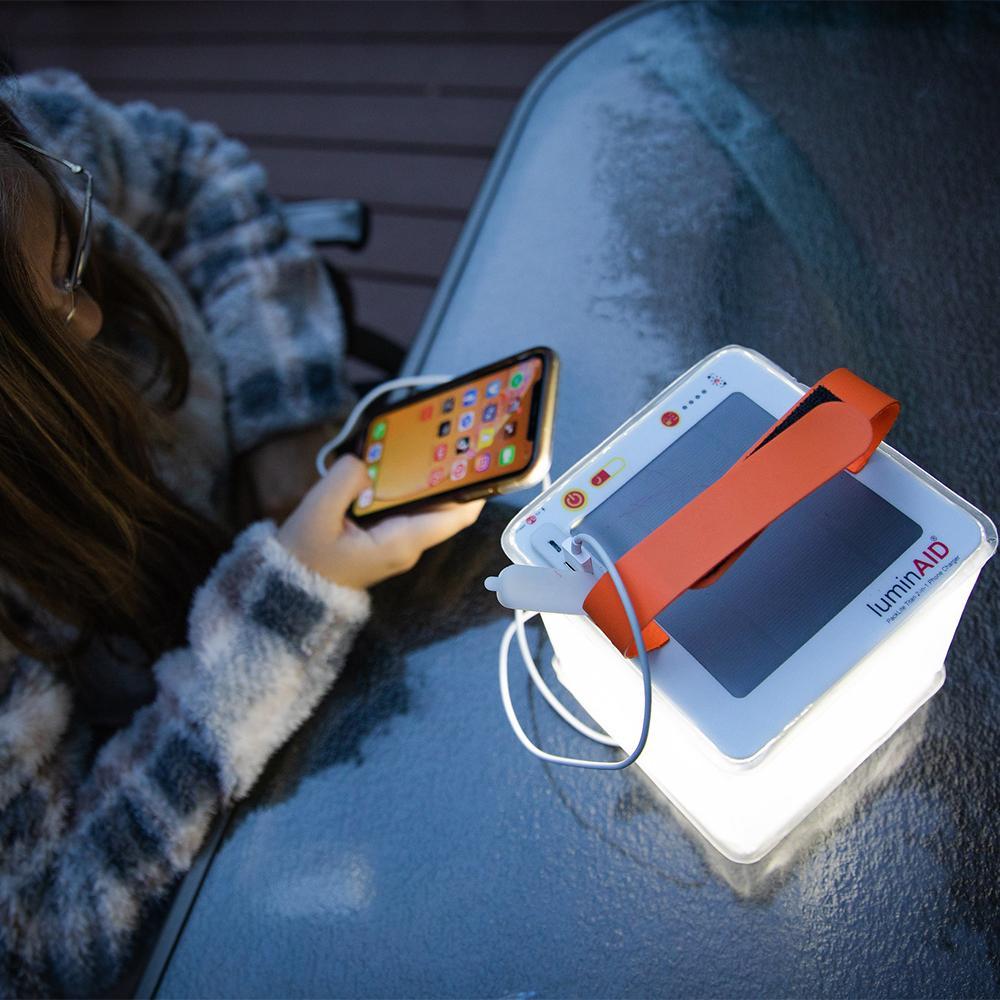 Bright Titan power lantern charging a phone in use.